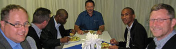 Rob Mackenzie – MD of E+H (right) seen enjoying his dinner